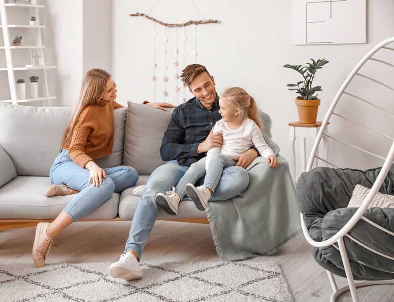 Happy family sitting on couch